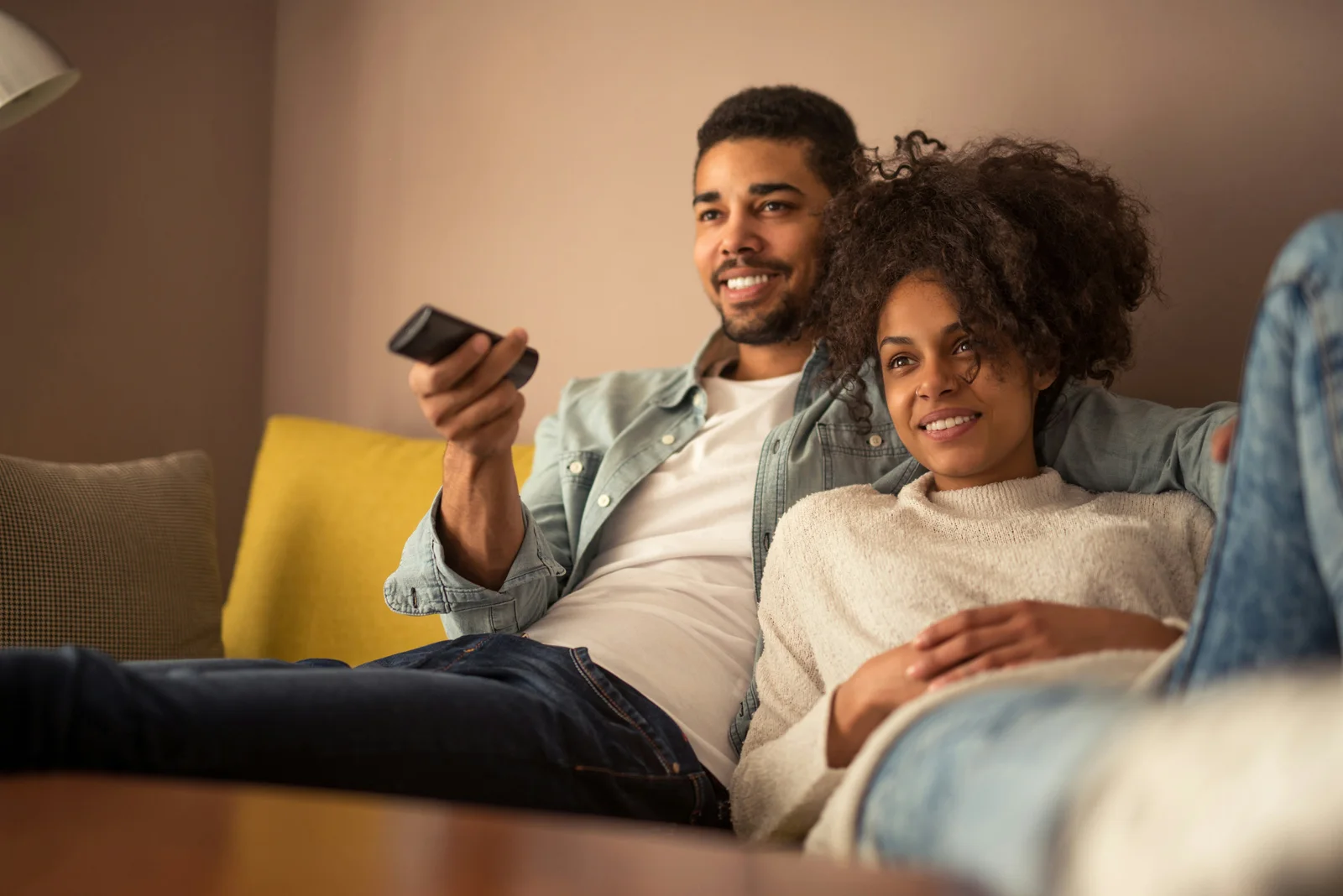 Couple enjoying a relaxed TV evening together